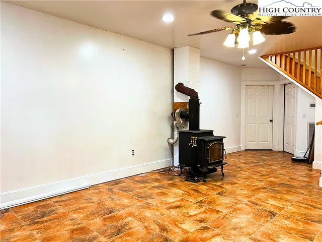 a view of a room with wooden floor and cabinet