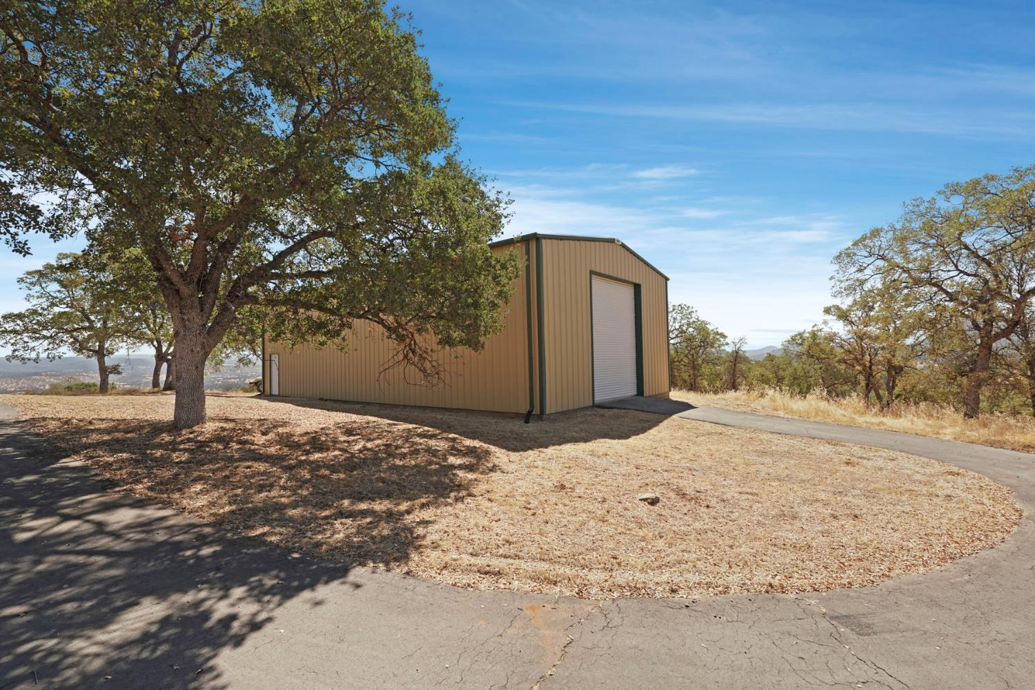 7425 Cincha Street Angels Camp, CA 95222 - Photo 6 of 29 a wooden bench sitting in middle of a snow