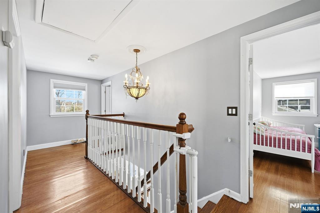 26 East Harrison Place Livingston, NJ 07039 - Photo 26 of 42 a view of an entryway wooden floor and windows