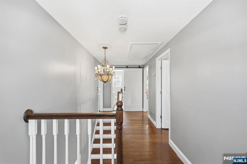 26 East Harrison Place Livingston, NJ 07039 - Photo 27 of 42 a view of a hallway with wooden floor