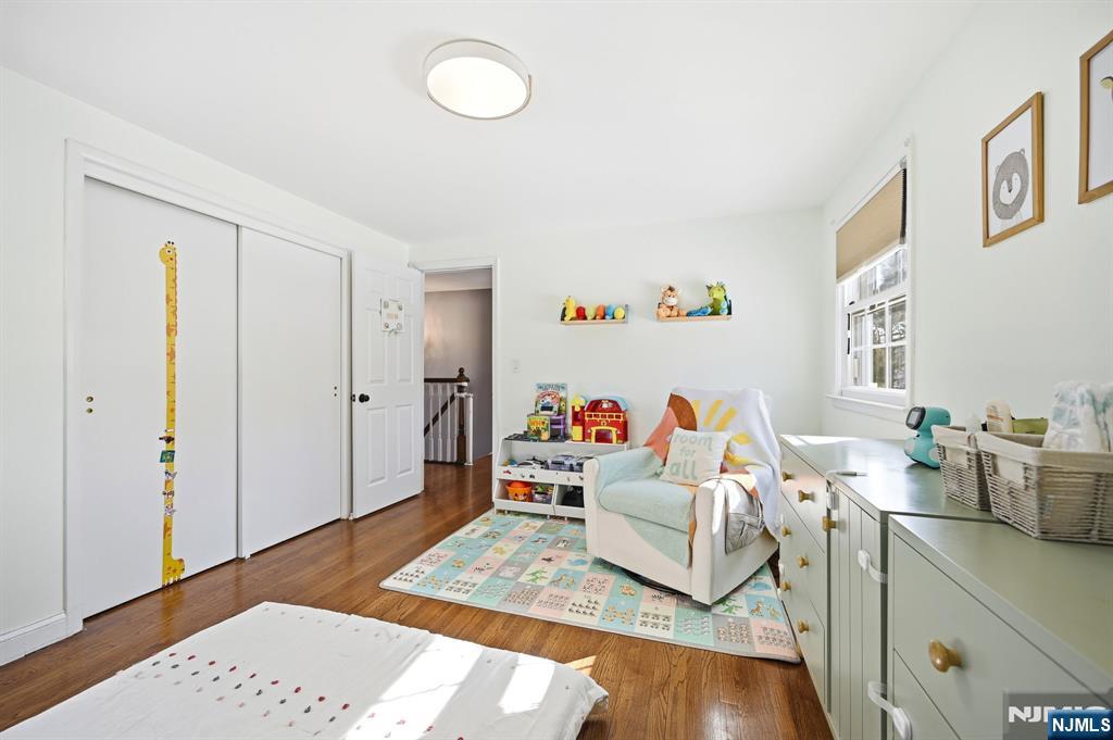 26 East Harrison Place Livingston, NJ 07039 - Photo 30 of 42 a living room with furniture and a wooden floor