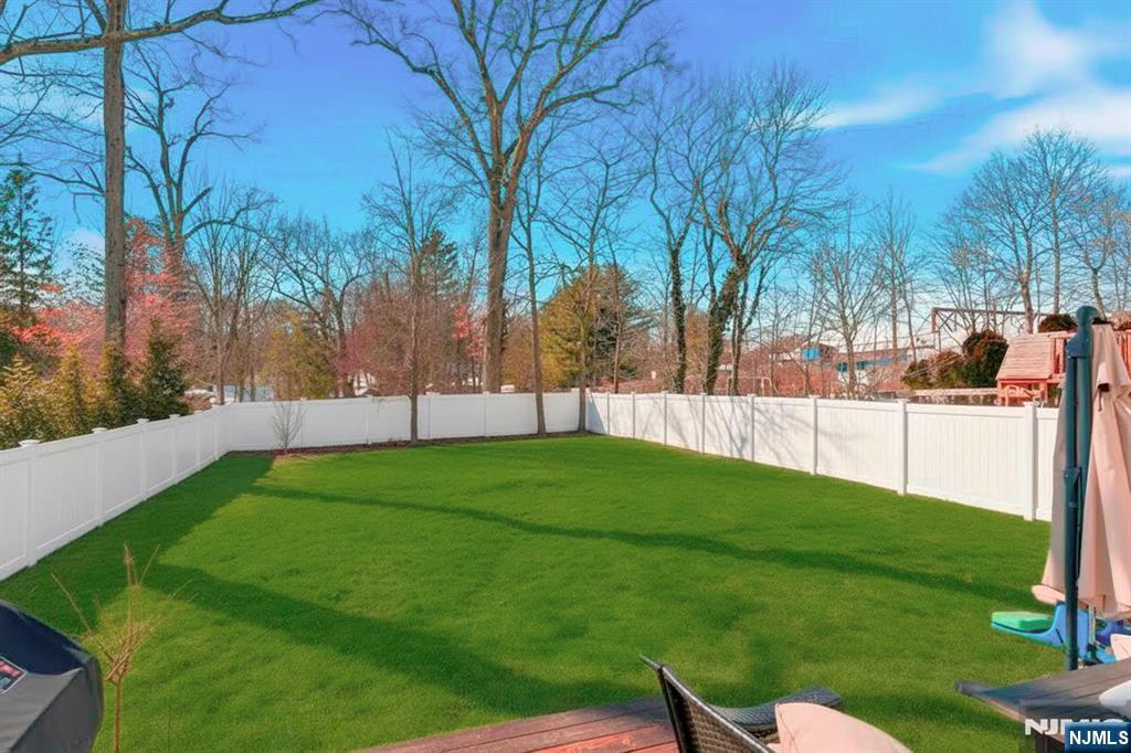 26 East Harrison Place Livingston, NJ 07039 - Photo 37 of 42 a view of yard with green space