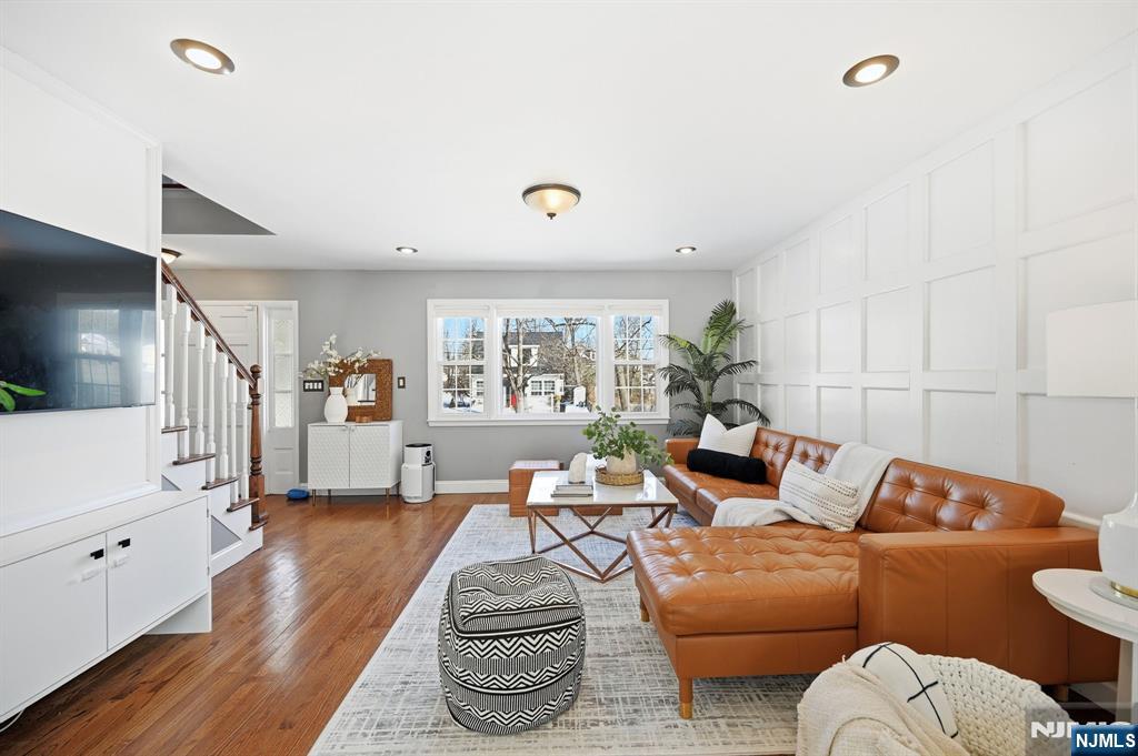 26 East Harrison Place Livingston, NJ 07039 - Photo 9 of 42 a living room with furniture kitchen view and a wooden floor
