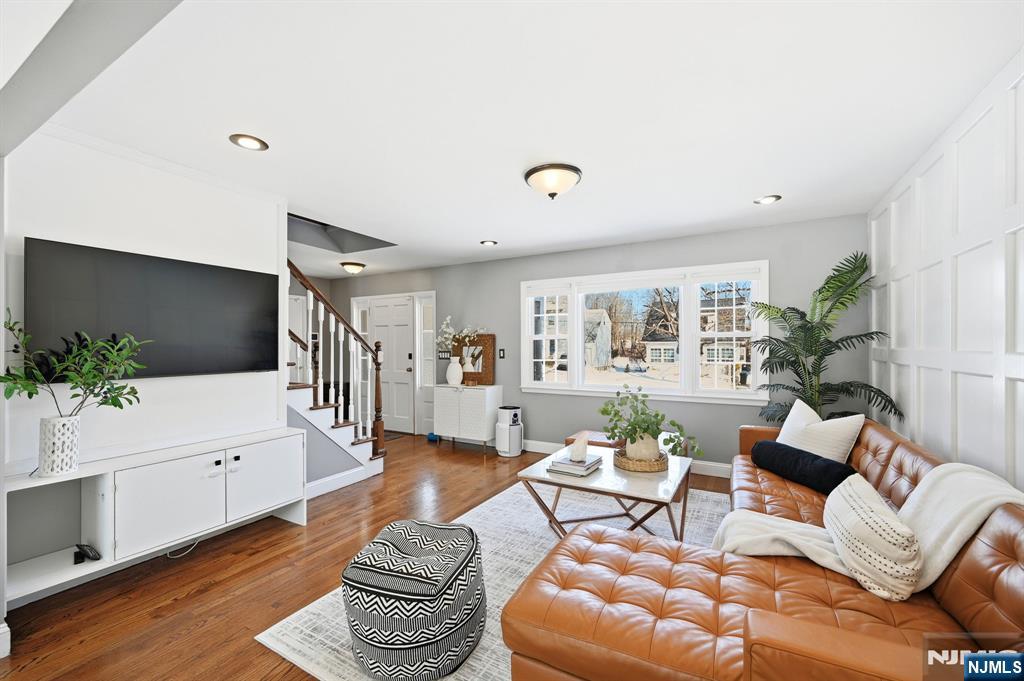26 East Harrison Place Livingston, NJ 07039 - Photo 10 of 42 a living room with furniture and a flat screen tv