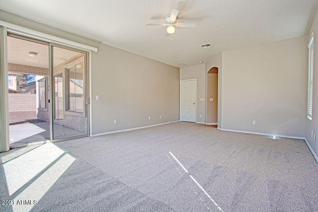 35210 North 30th Drive Phoenix, AZ 85086 - Photo 15 of 37 an empty room with fan and entrance