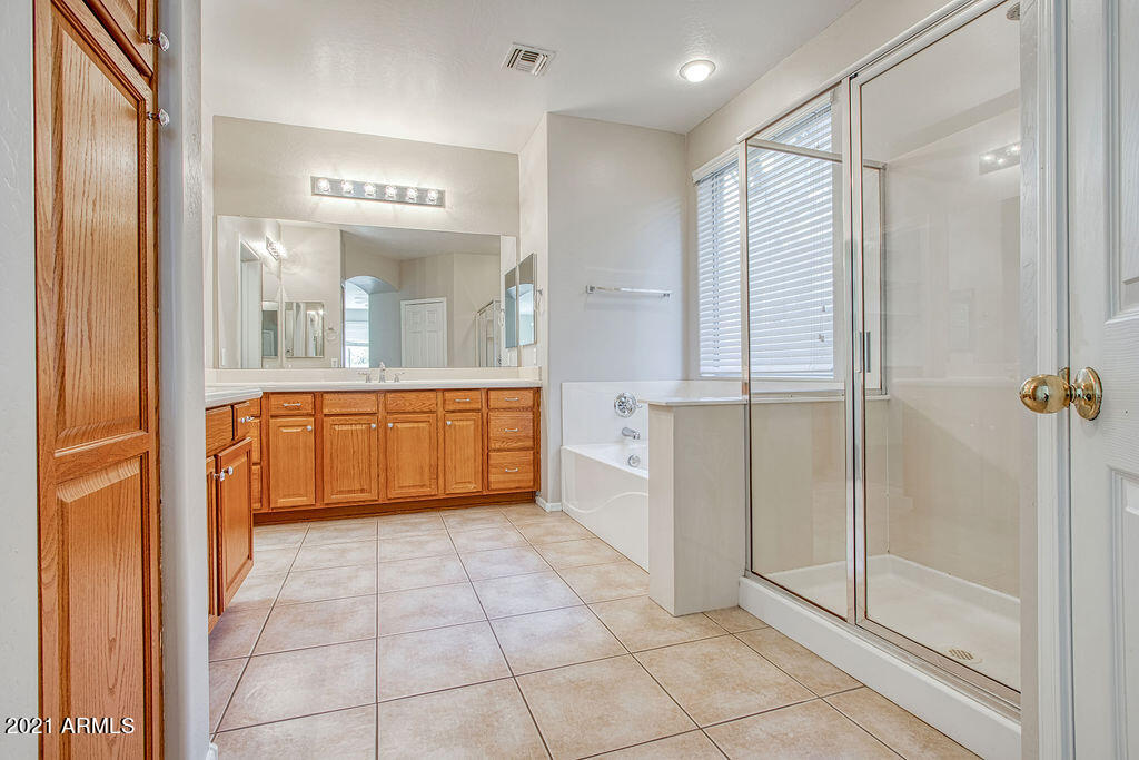 35210 North 30th Drive Phoenix, AZ 85086 - Photo 16 of 37 a view of a bathroom with sink mirror and window