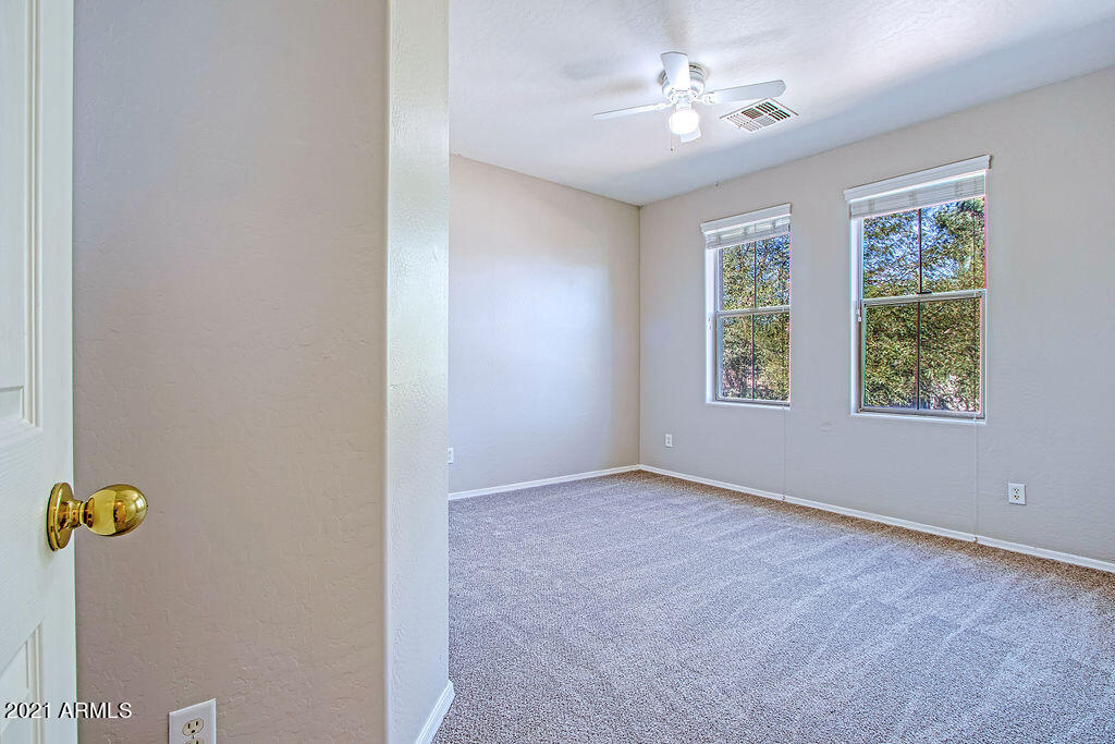 35210 North 30th Drive Phoenix, AZ 85086 - Photo 21 of 37 an empty room with windows and ceiling fan