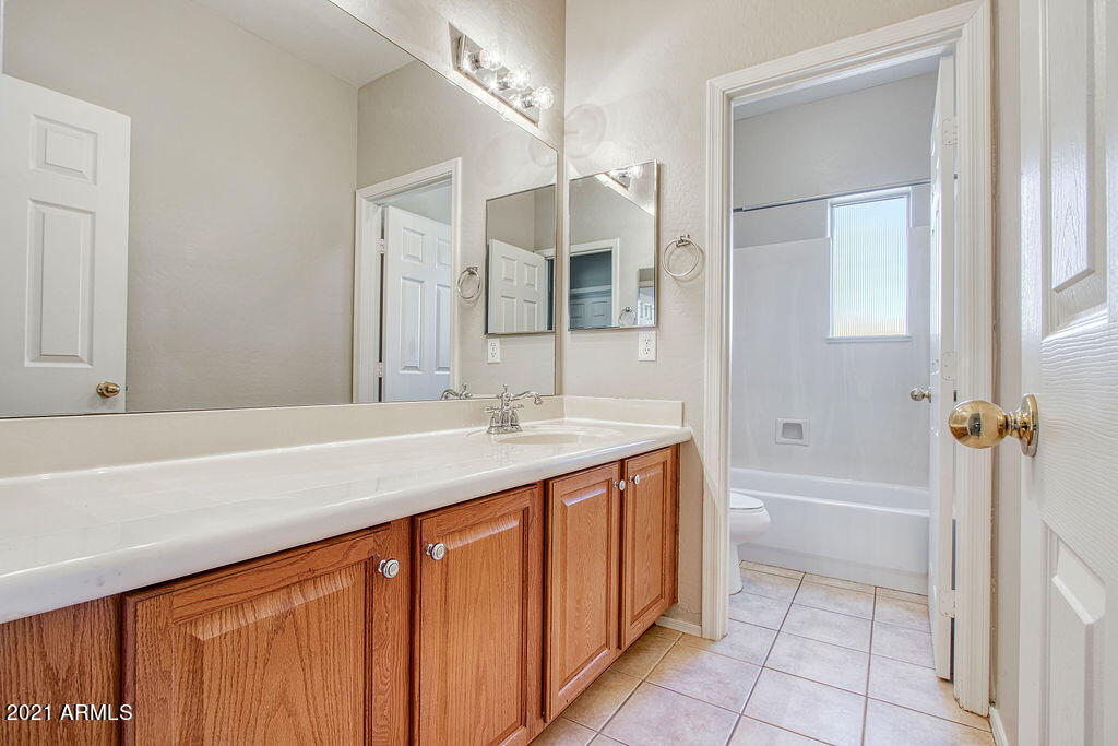 35210 North 30th Drive Phoenix, AZ 85086 - Photo 29 of 37 a bathroom with a granite countertop sink and a mirror