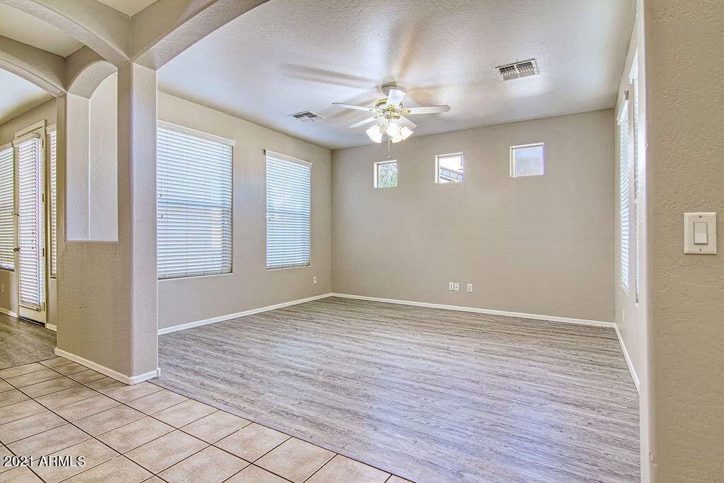 35210 North 30th Drive Phoenix, AZ 85086 - Photo 4 of 37 wooden floor in an empty room with a window