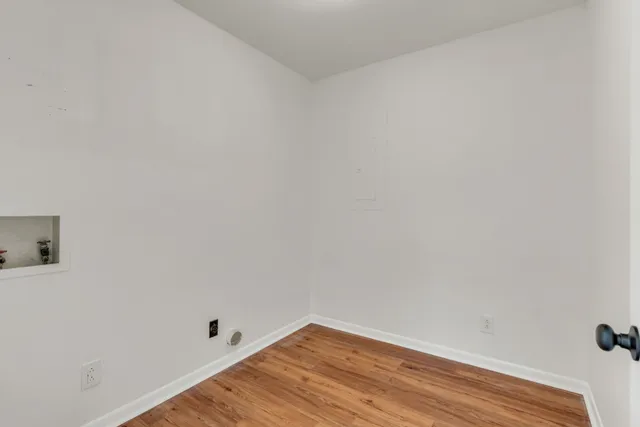 a view of small space with wooden floor