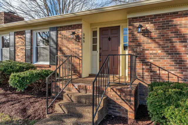 a front view of a house with a glass windows