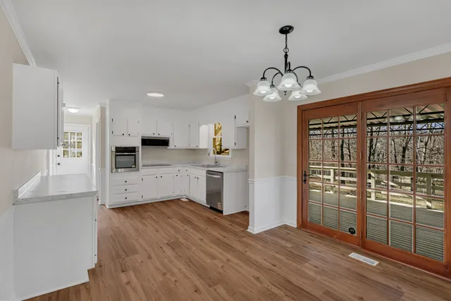 a view of a kitchen with electric appliances