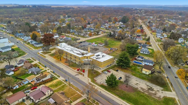 an aerial view of residential building and parking space