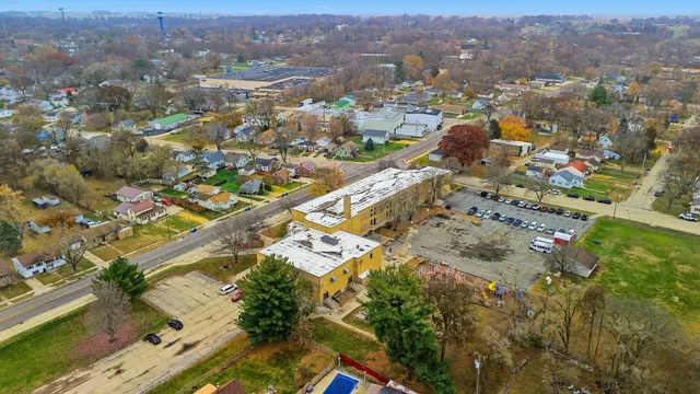 an aerial view of residential houses with outdoor space