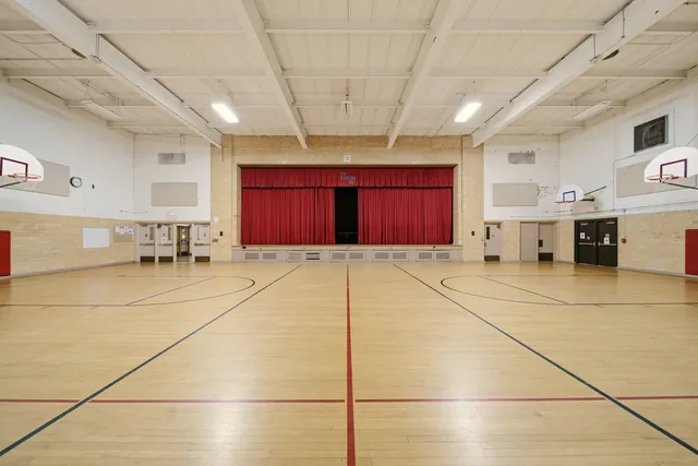 a room with gym equipment and window