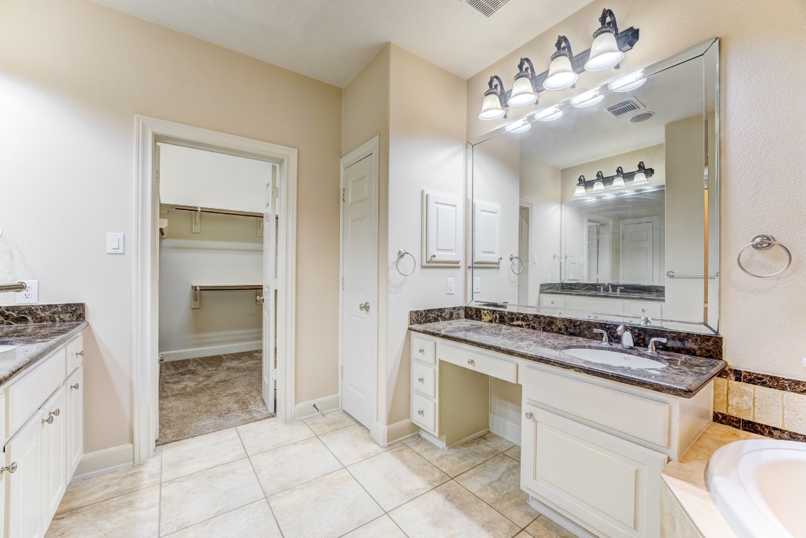 7938 Wooded Way Drive Spring, TX 77389 - Photo 16 of 47 This Primary bath also features a separate vanity areaand, His and Her vanities and Large walk in shower.