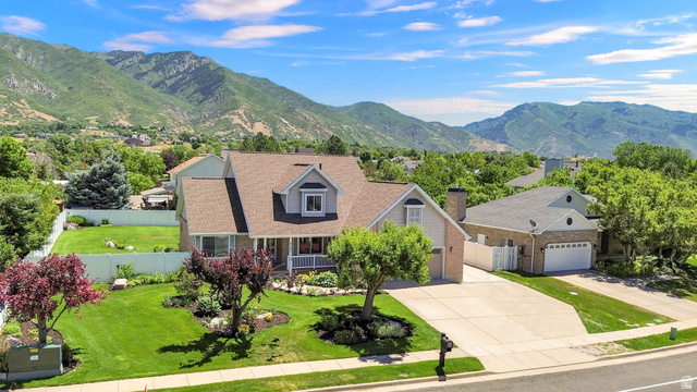 4792 Glasmann Way South Ogden, UT 84403 - Photo 8 of 70 Two-story residence featuring a covered front porch, dormer windows, and a paved driveway