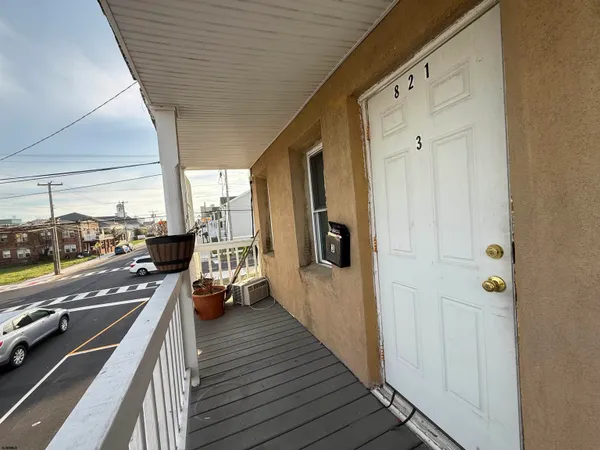 a view of a balcony with wooden floor