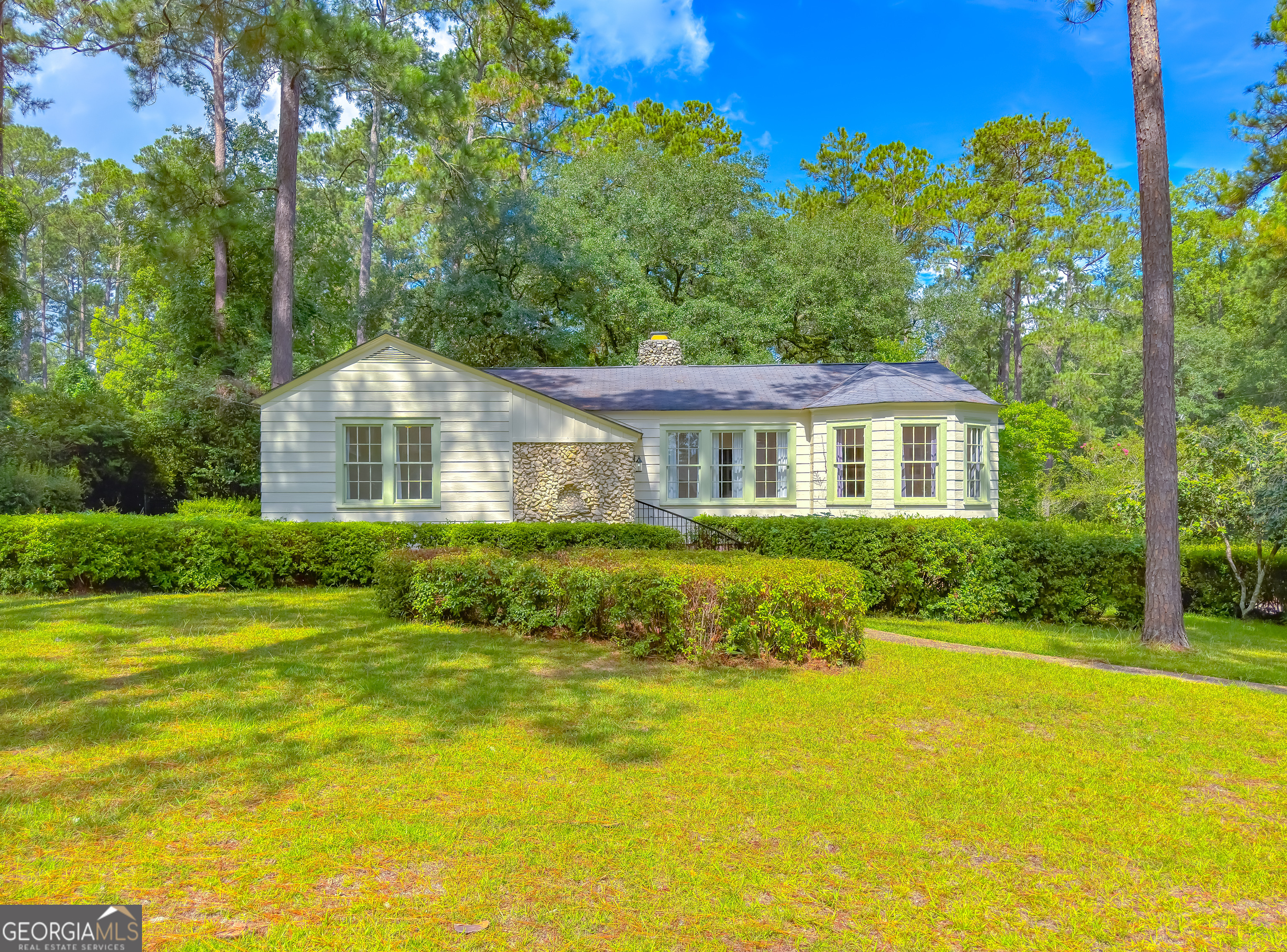 a front view of a house with swimming pool