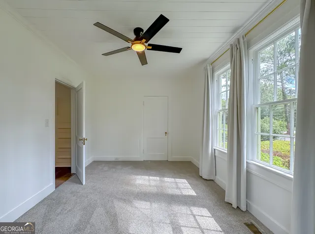 a view of an empty room and window