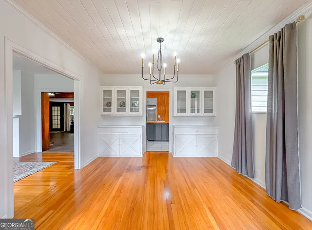 a kitchen that has a sink and a stove in it