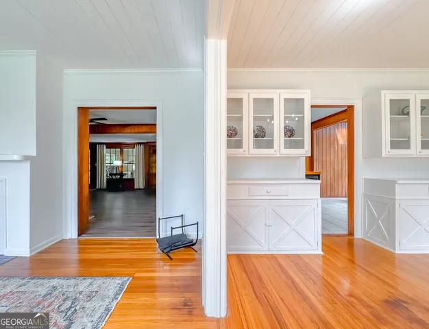 a bathroom with a tub a sink and mirror