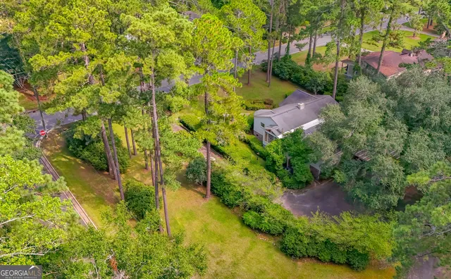a view of a house with a yard porch and sitting area