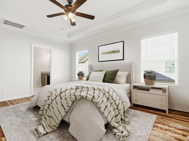 a bedroom with a large bed and a window