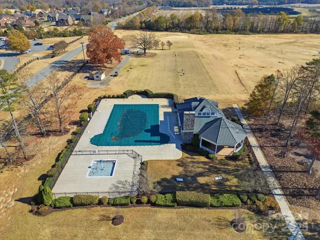 a building with glass top table and chairs
