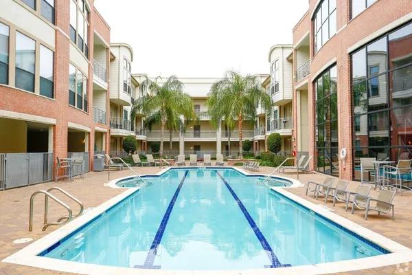 a view of a house with swimming pool and sitting area
