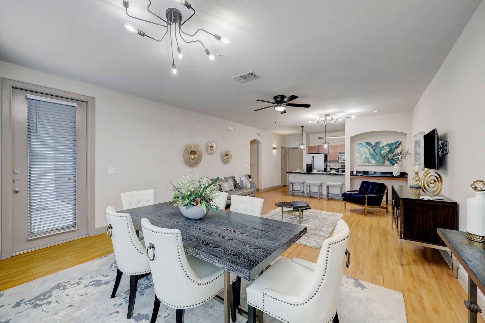 2401 South Gessner Road, Unit D Houston, TX 77063 - Photo 5 of 10 a view of a dining room with furniture and wooden floor