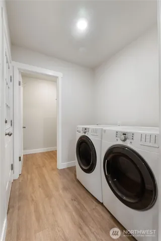 a view of a storage & utility room with washer and dryer
