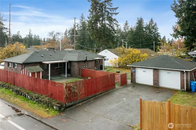 an aerial view of a house with a yard