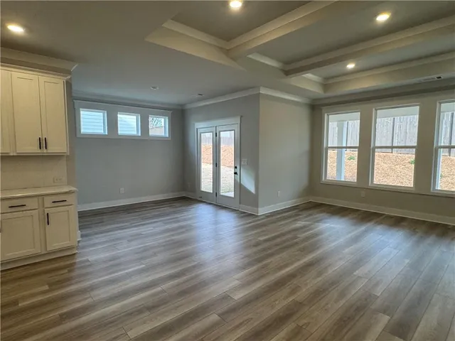 a large kitchen with a large counter top appliances and cabinets