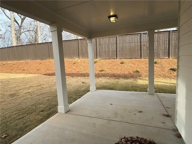 a view of a backyard of the house