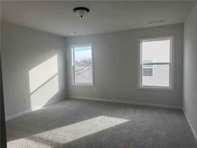 a front view of a house with a yard table and chairs