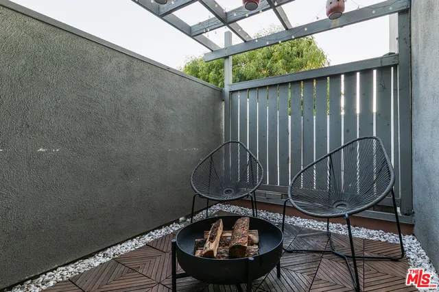 a view of a balcony with chair
