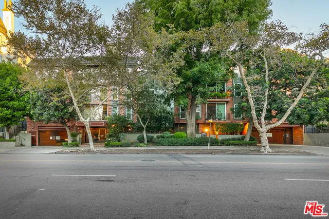 a view of street along with trees