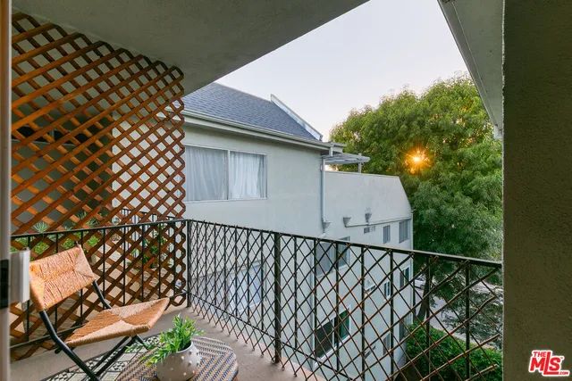 a view of a wooden fence and a bench