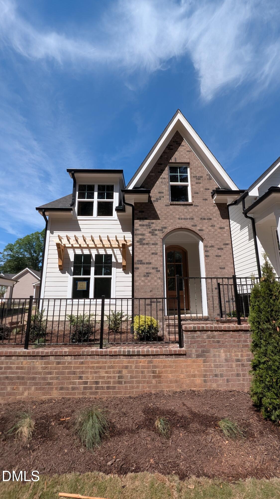 a front view of a house with garage