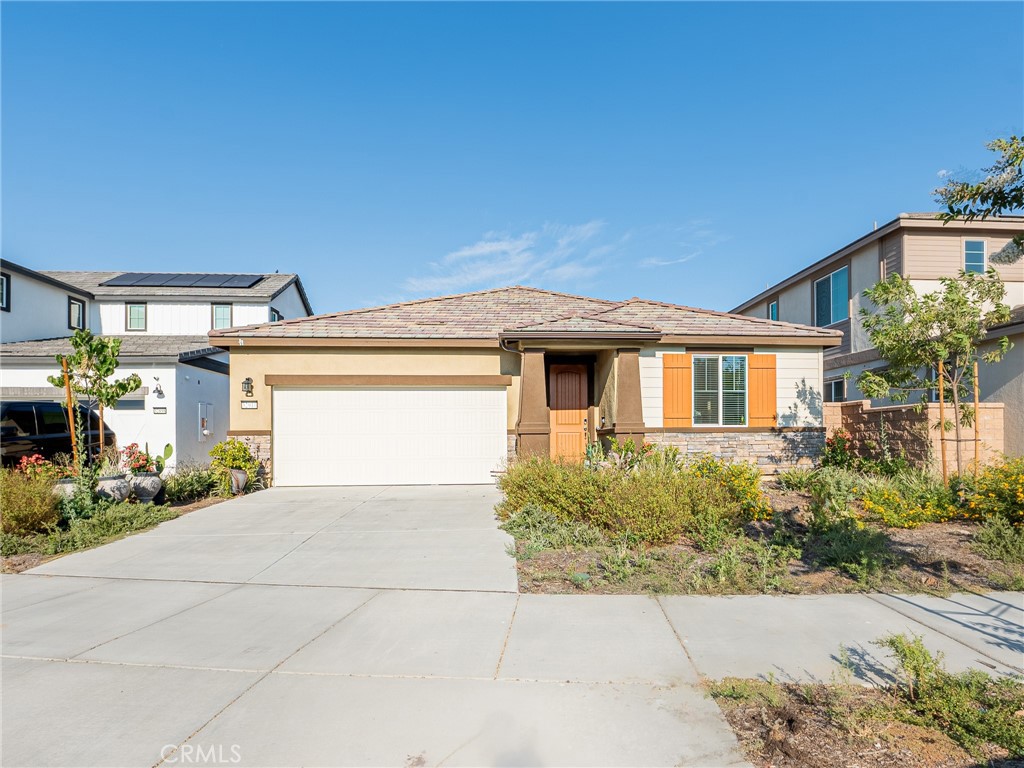 32910 Linecroft Court Menifee, CA 92584 - Photo 1 of 1 a front view of a house with a yard and garage