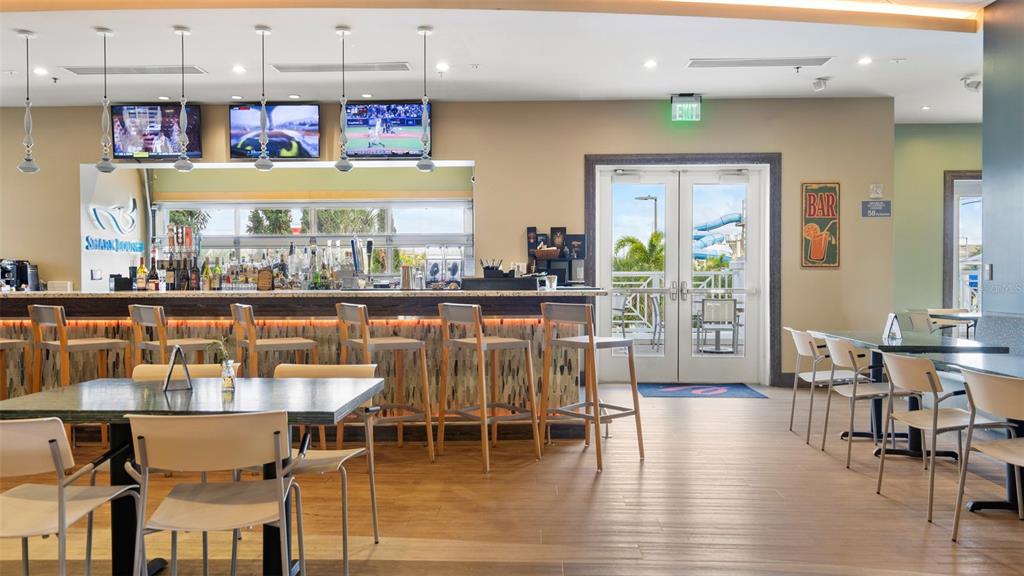 7855 Poplin Street Kissimmee, FL 34747 - Photo 14 of 15 a dining room with furniture and wooden floor