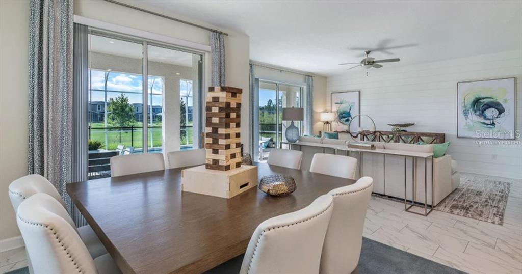 7855 Poplin Street Kissimmee, FL 34747 - Photo 3 of 15 a living room with furniture and a large window