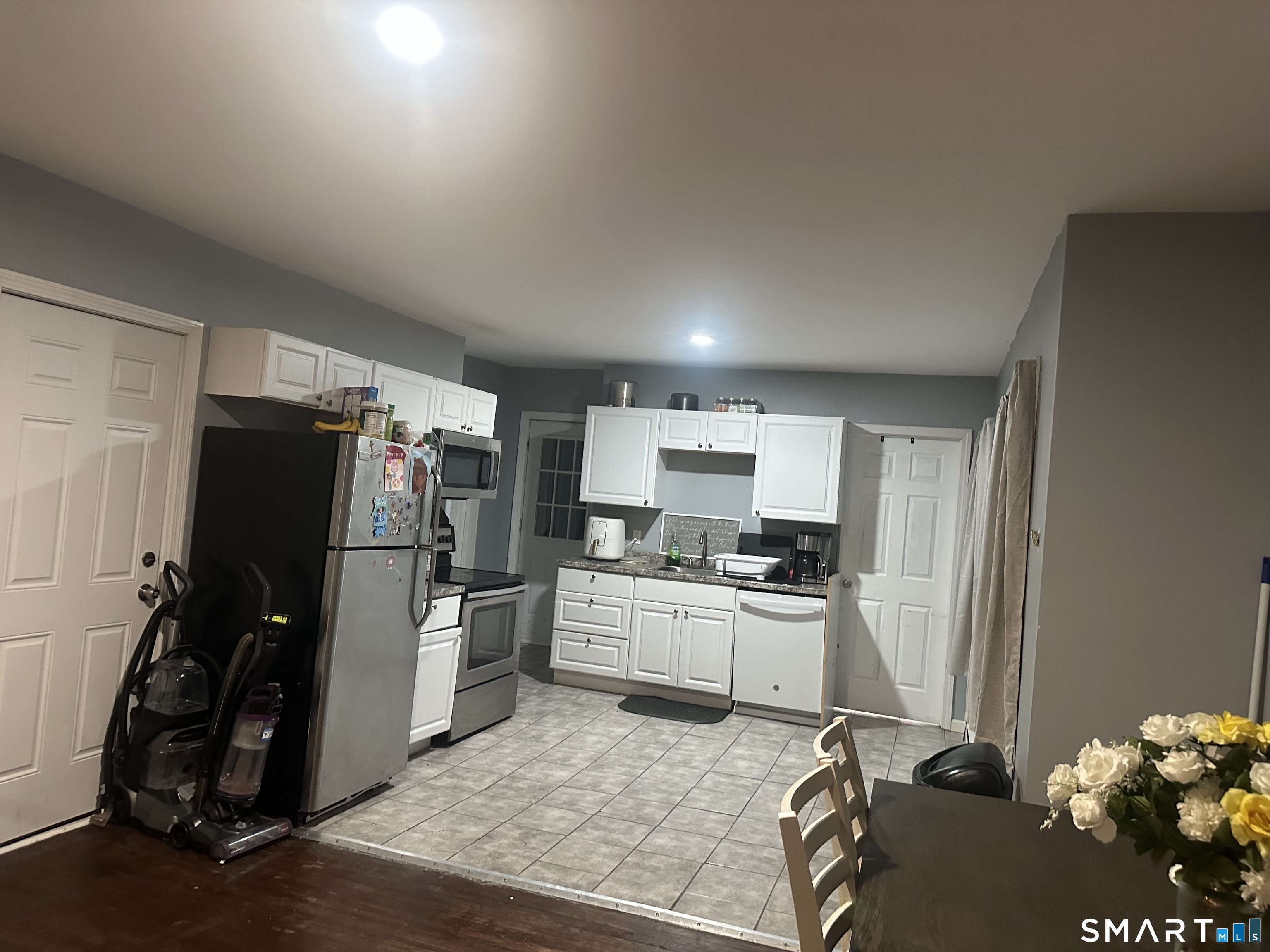 253 Riverside Avenue Torrington, CT 06790 - Photo 13 of 15 a kitchen with a refrigerator and a stove top oven