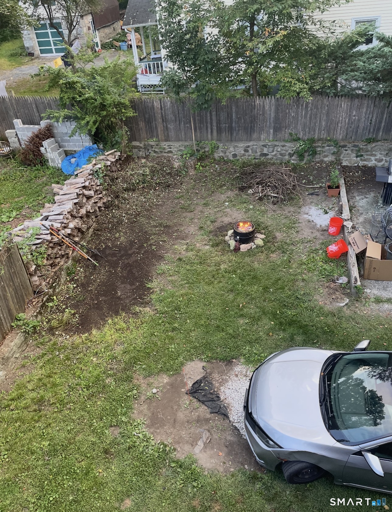 253 Riverside Avenue Torrington, CT 06790 - Photo 14 of 15 a backyard of a house with yard and outdoor seating
