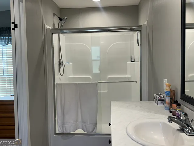 a bathroom with a sink and a mirror