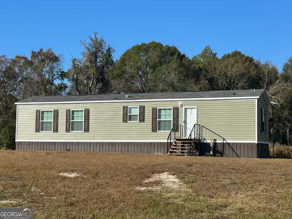 a house with trees in the background