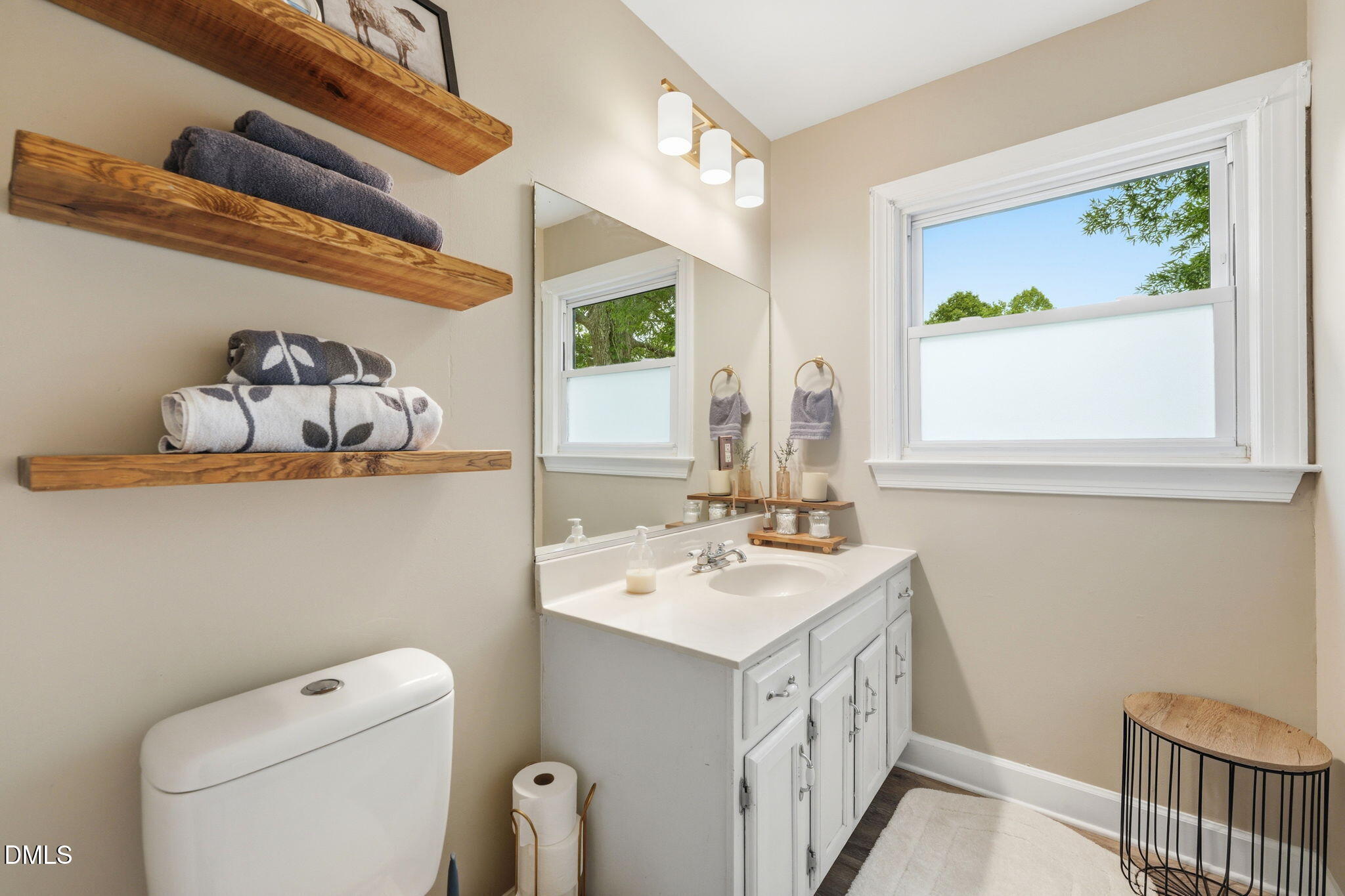 3200 Mill Creek Road Efland, NC 27243 - Photo 40 of 44 a bathroom with a sink a toilet and a window