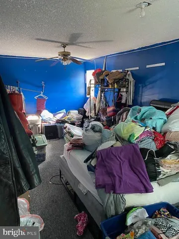 a dining room with furniture and a rug