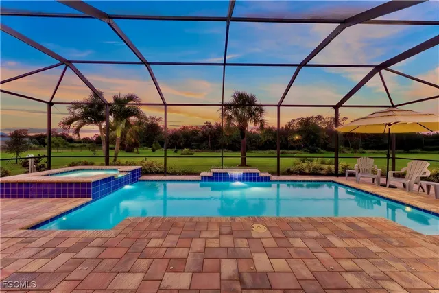 a view of a backyard with swimming pool